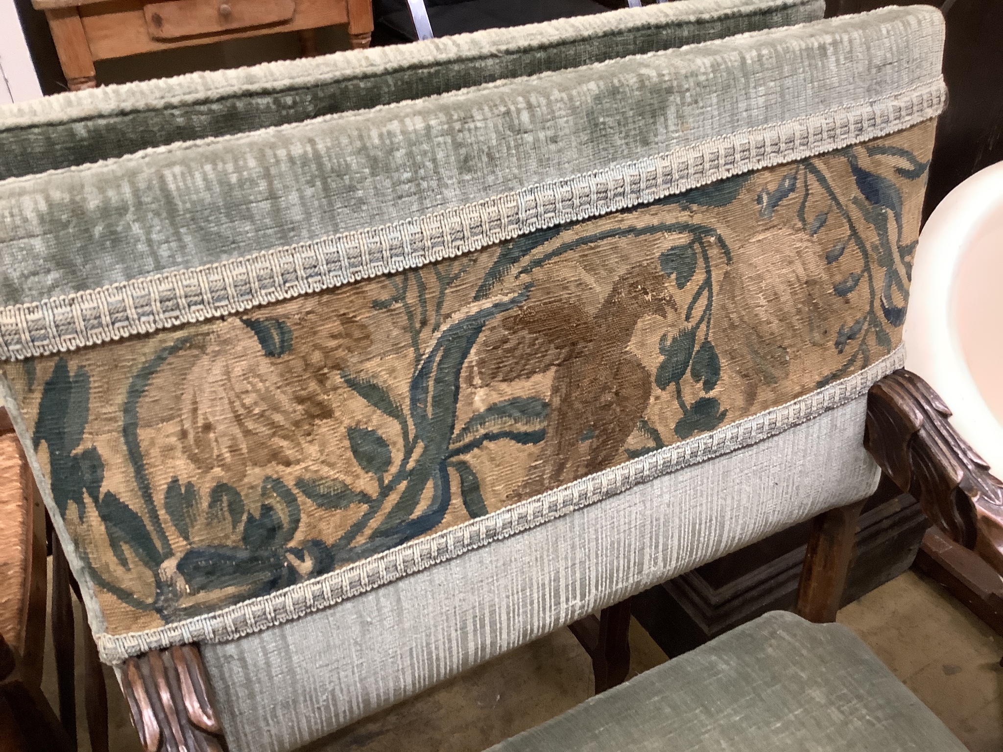 A pair of 18th century French walnut armchairs.